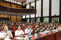 Các đại biểu tại điểm cầu trung tâm Bộ Quốc phòng. (Ảnh trong bài: Tuấn Huy)