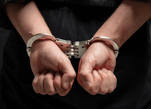 hands-handcuffs-closeup-view-crime-600nw-2559673101-1747975394.webp.webp-x-api-version1.0