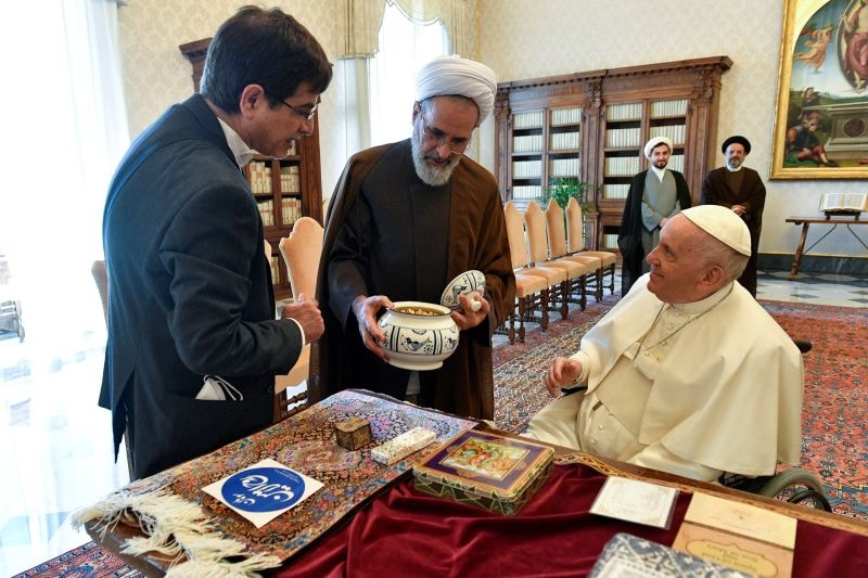 Pope Francis is shown a gift as he receives Ayatollah Alireza Arafi, president of Islamic Seminaries of Iran, and entourage in a private audience at the Vatican May 30, 2022.